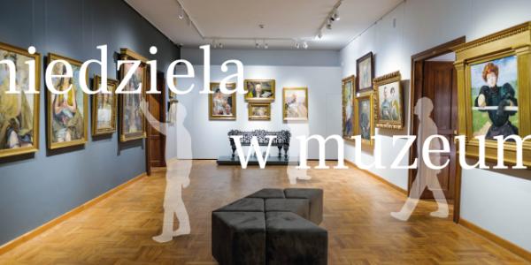 Fotografia galerii muzealnej z obrazami, ławką i sylwetkami zwiedzających